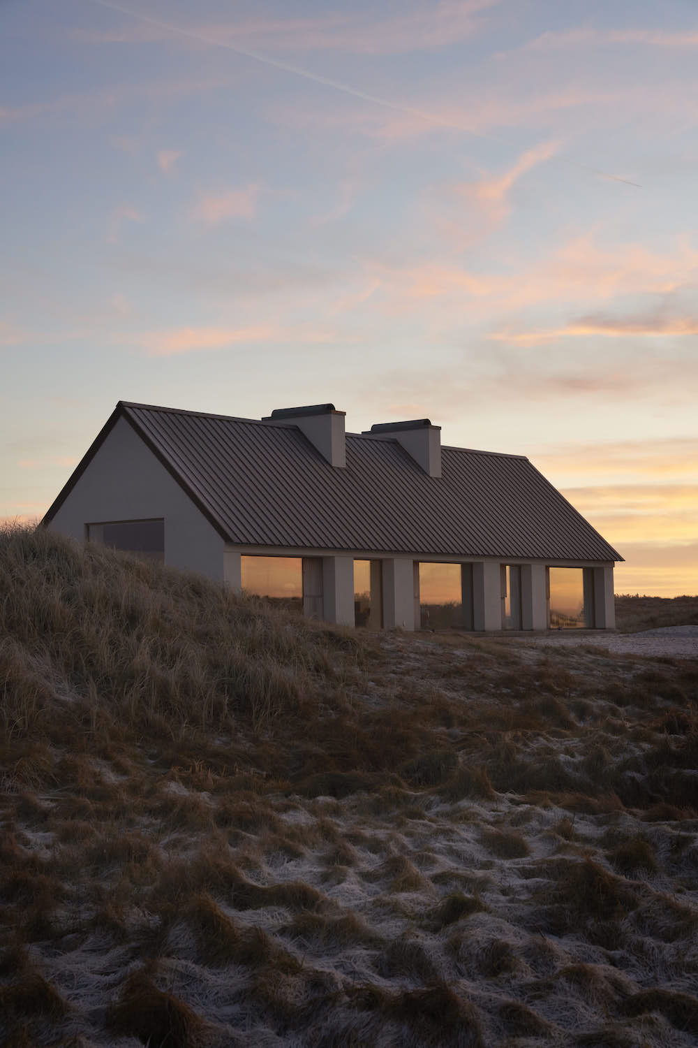 Modern Danish summer house at dawn.